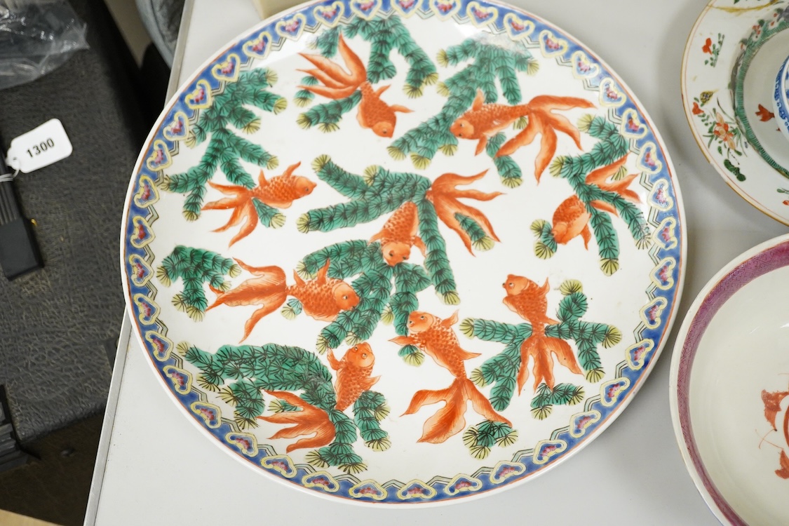 A collection of Chinese ceramics, 18th century and later to include a blue and white vase and cover, ‘goldfish’ charger and various bowls, largest 36cm in diameter